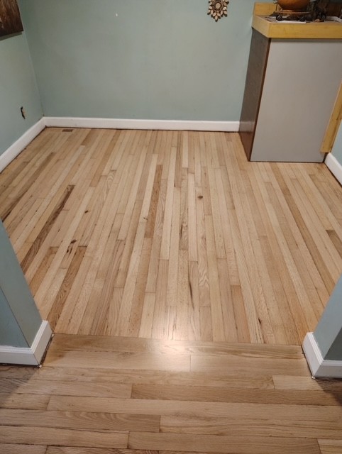 Finished flooring example in a room with newly installed floors